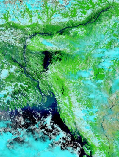 Large areas of parts of Bangladesh (left of center) and India (left edge and upper right) are under water, 3 August 2003. Bright blue is rivers, lakes and flooded areas. Dark area left foreground is Bay of Bengal by National Aeronautics and Space Administration National Aeronautics and Space Administration